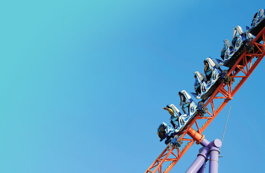 People Riding a Rollercoaster
