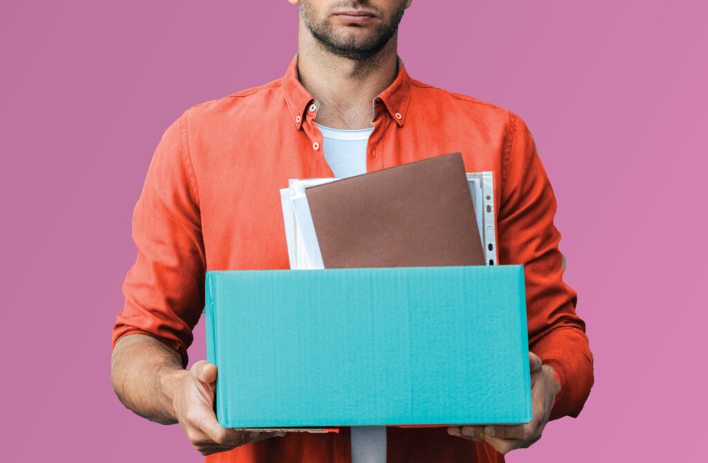 Man Carrying Office Items in Box