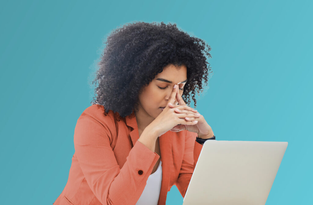 Woman Resting Eyes With Hands on Her Face